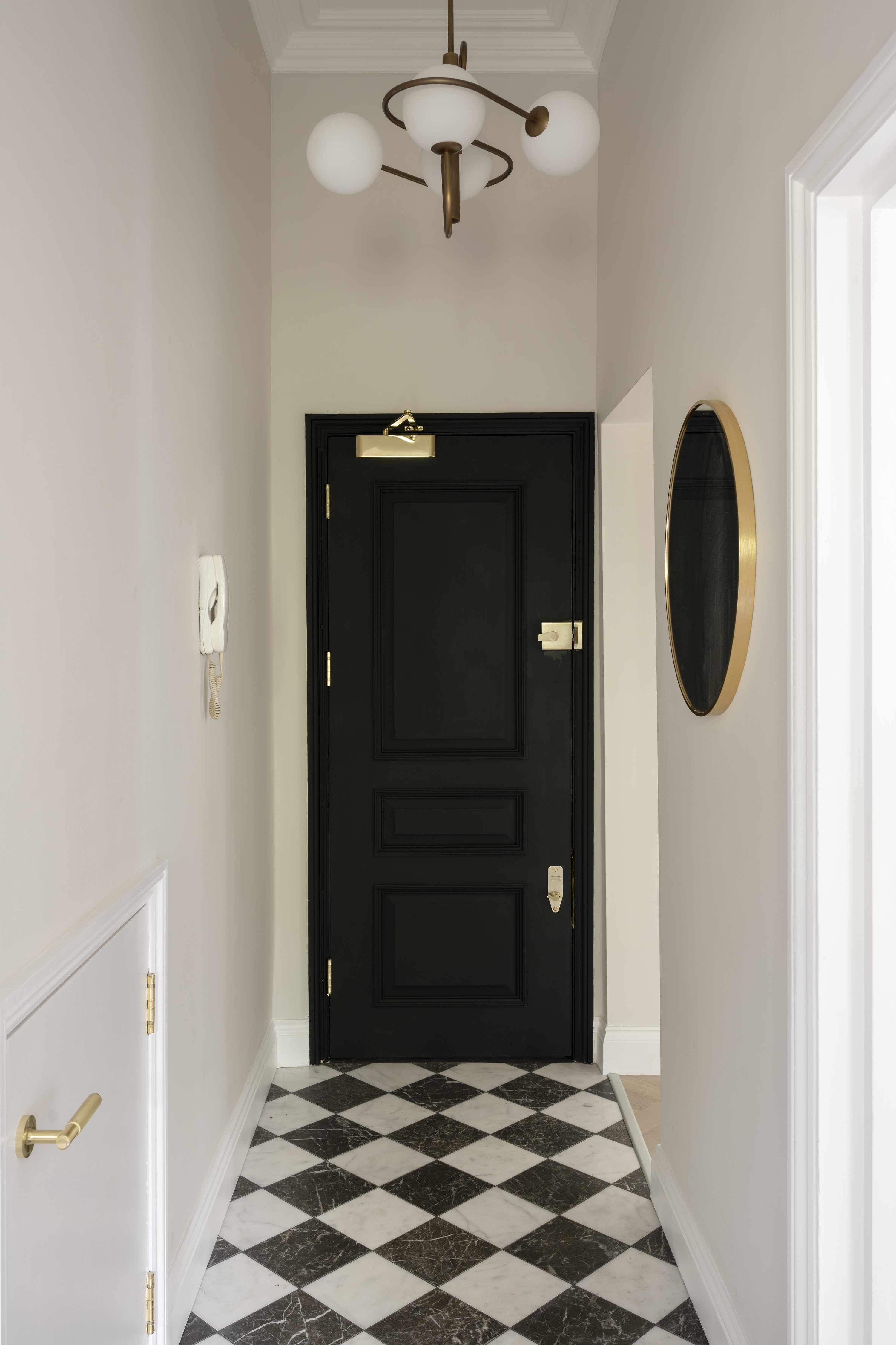 Hallway with checkerboard tiles