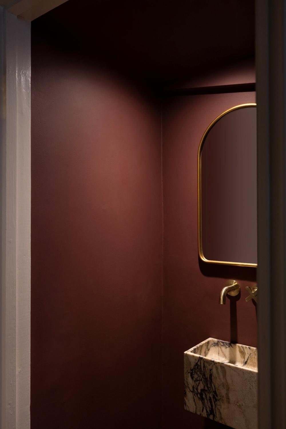 A jewel-tone cloakroom in a recent renovation