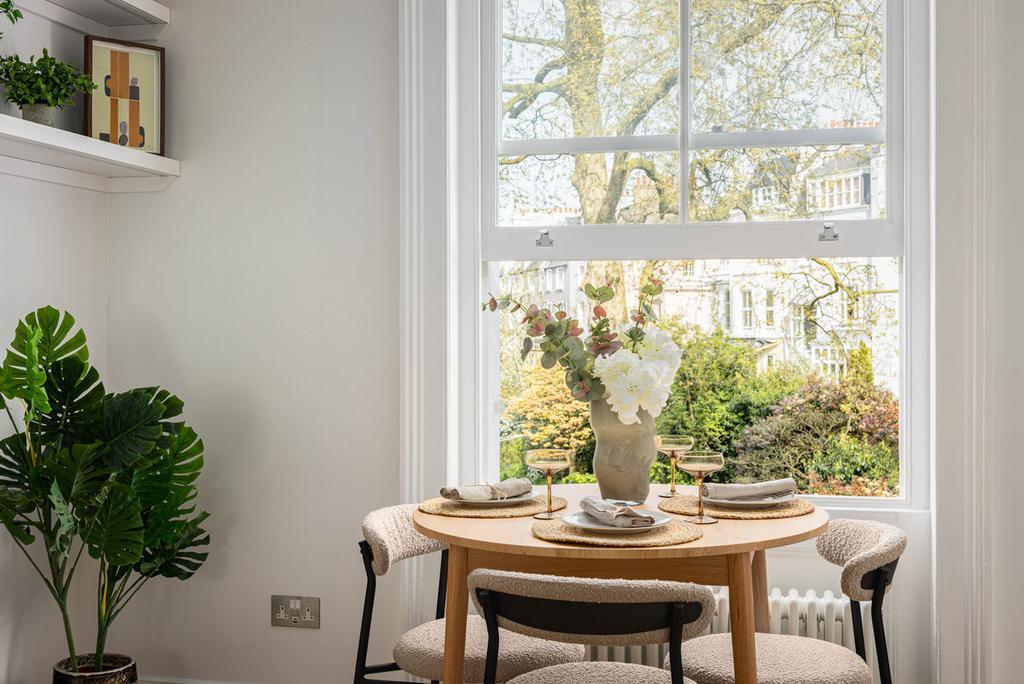 Dining nook by sash window